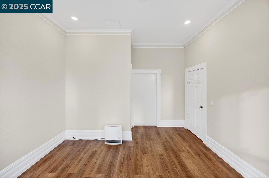 3229 Elm Street Oakland, CA 94609 - Photo 4 of 18 a view of a room with wooden floor and white walls