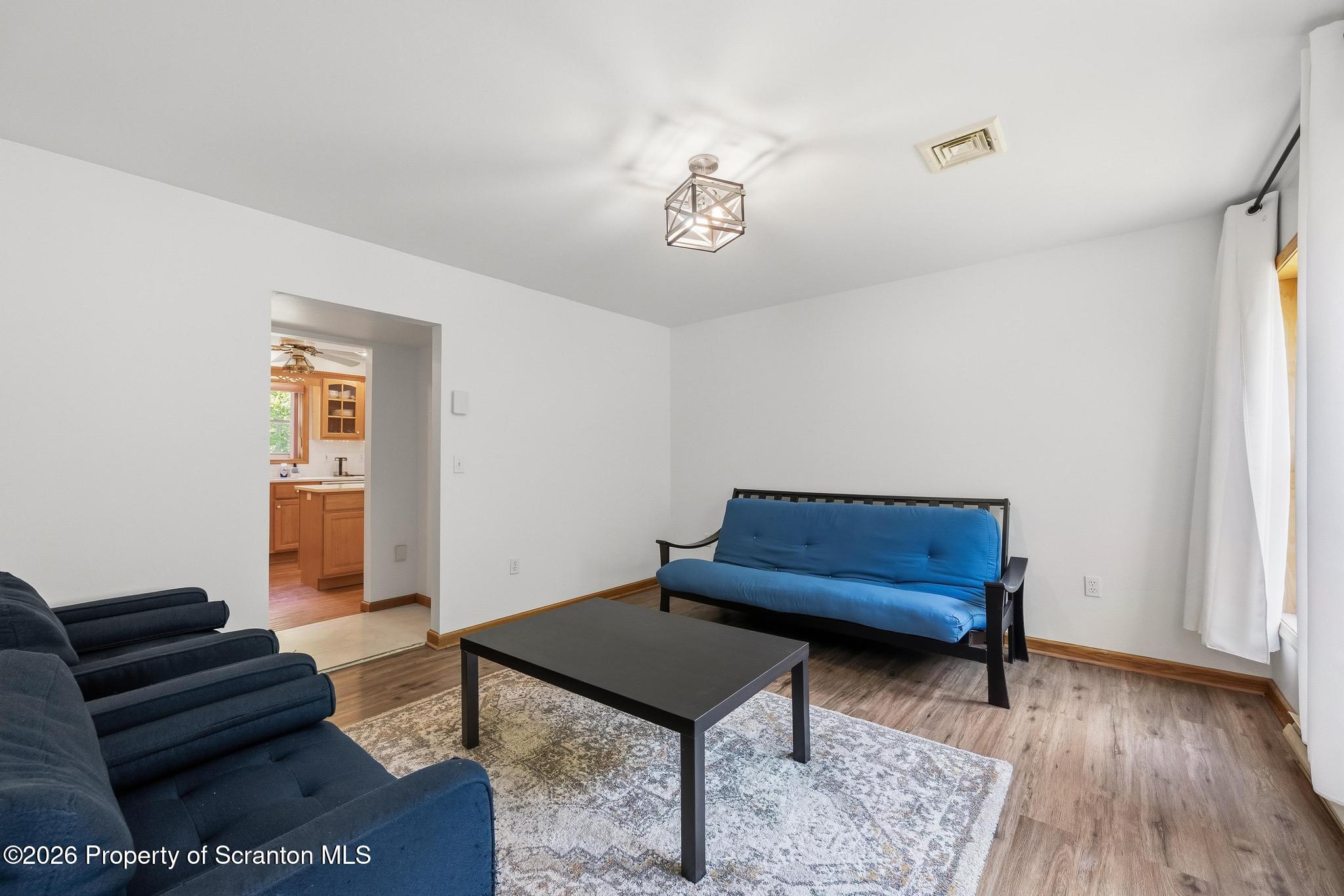 58 Bender Road Gouldsboro, PA 18424 - Photo 34 of 55 a living room with furniture and a wooden floor
