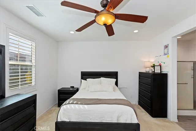 a bathroom with a double vanity sink a mirror and a shower