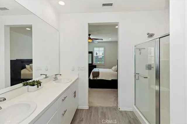 a white toilet sitting next to a white sink