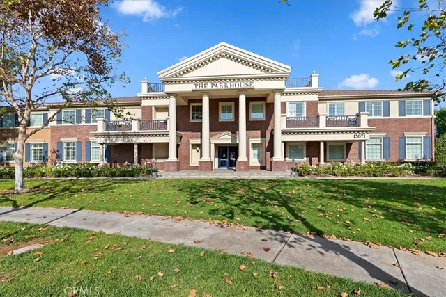 a swimming pool with a yard and outdoor seating