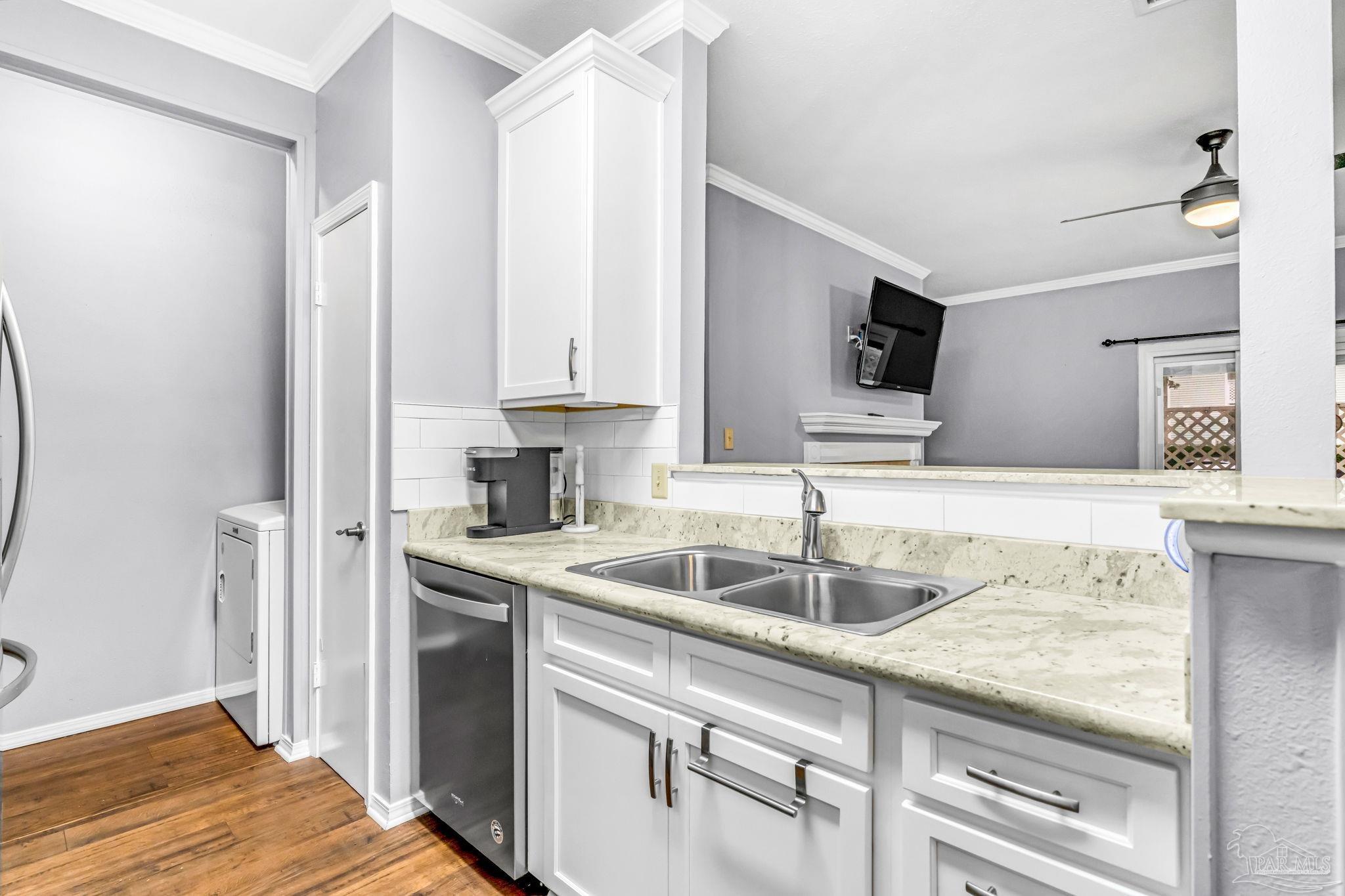 601 East Burgess Road, Unit C4 Pensacola, FL 32504 - Photo 17 of 28 a kitchen with granite countertop a sink a counter space and cabinets
