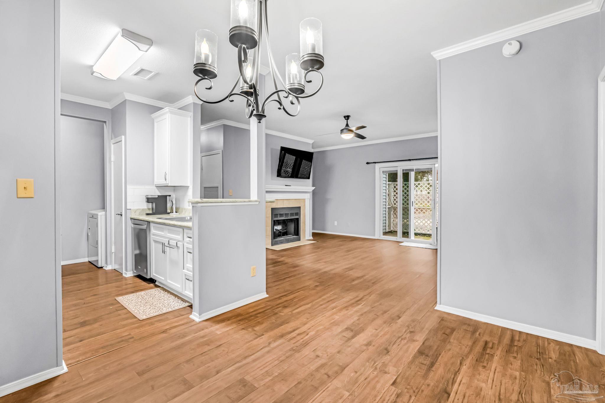 601 East Burgess Road, Unit C4 Pensacola, FL 32504 - Photo 19 of 28 a view of a kitchen with a sink wooden floor and cabinets
