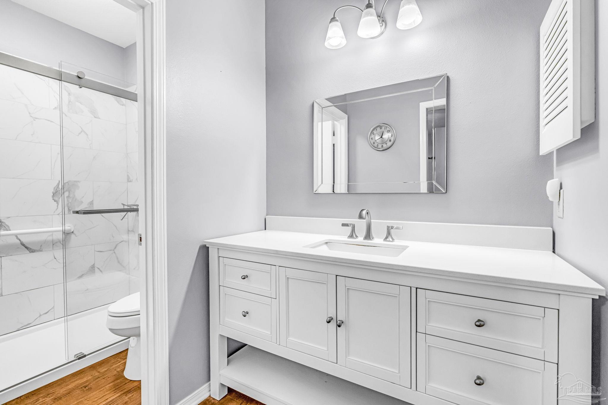 601 East Burgess Road, Unit C4 Pensacola, FL 32504 - Photo 22 of 28 a bathroom with a granite countertop sink mirror and double