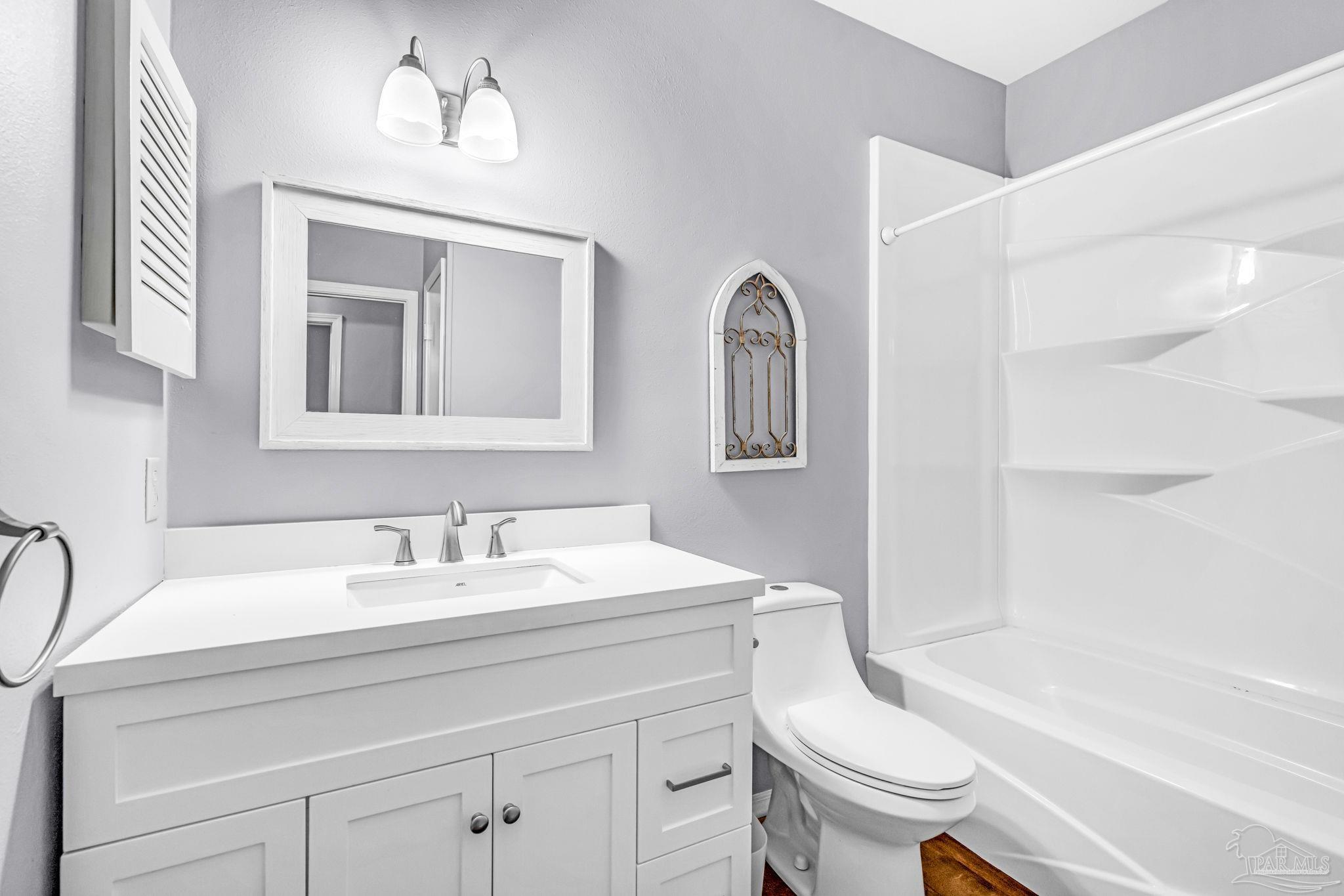 601 East Burgess Road, Unit C4 Pensacola, FL 32504 - Photo 26 of 28 a bathroom with a sink a toilet and a bathtub