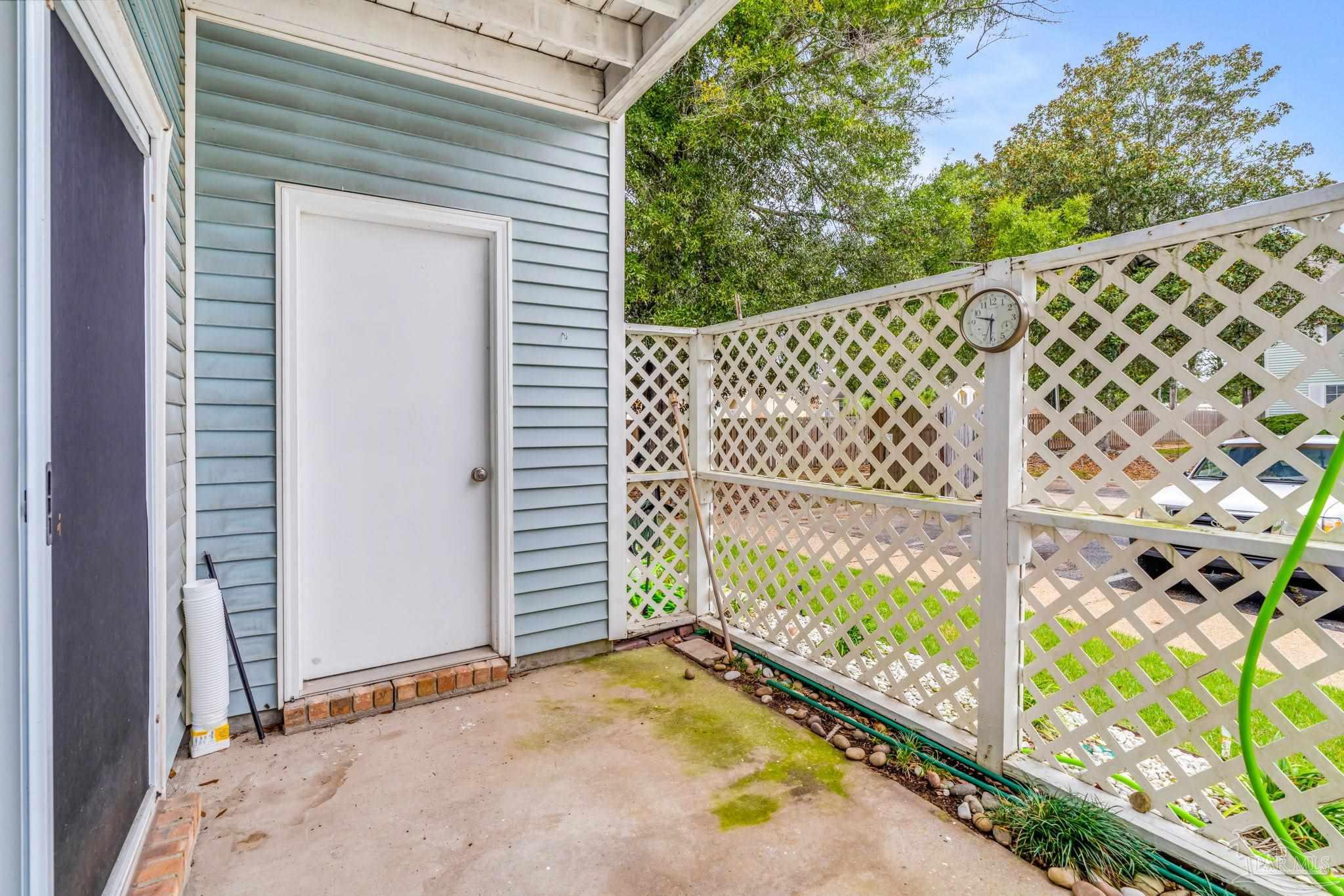 601 East Burgess Road, Unit C4 Pensacola, FL 32504 - Photo 27 of 28 a view of a door with a wooden fence