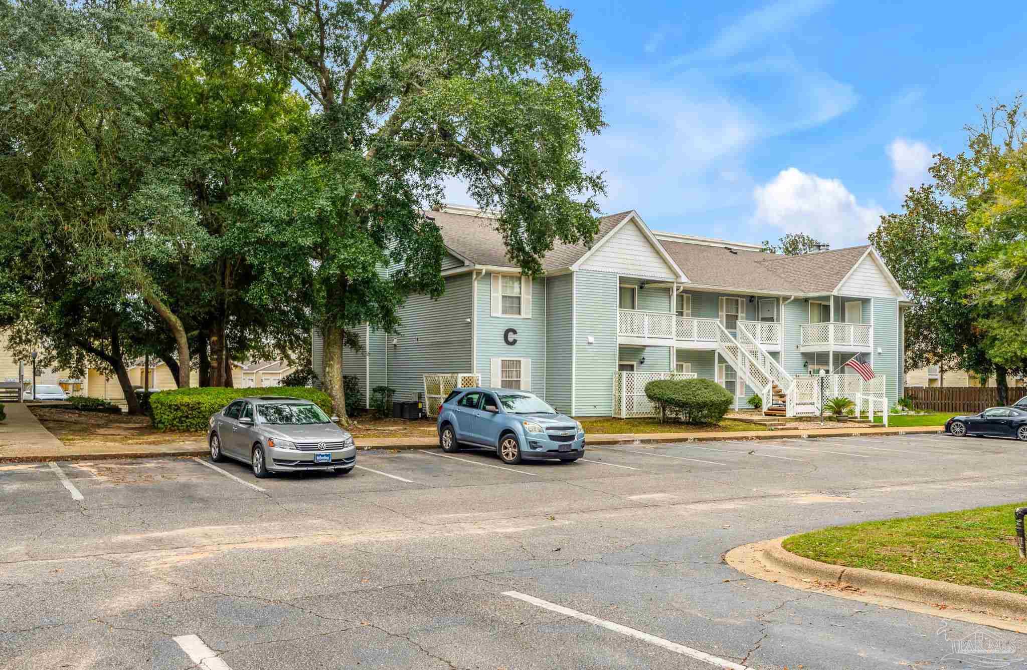 601 East Burgess Road, Unit C4 Pensacola, FL 32504 - Photo 3 of 28 a car parked in front of a building