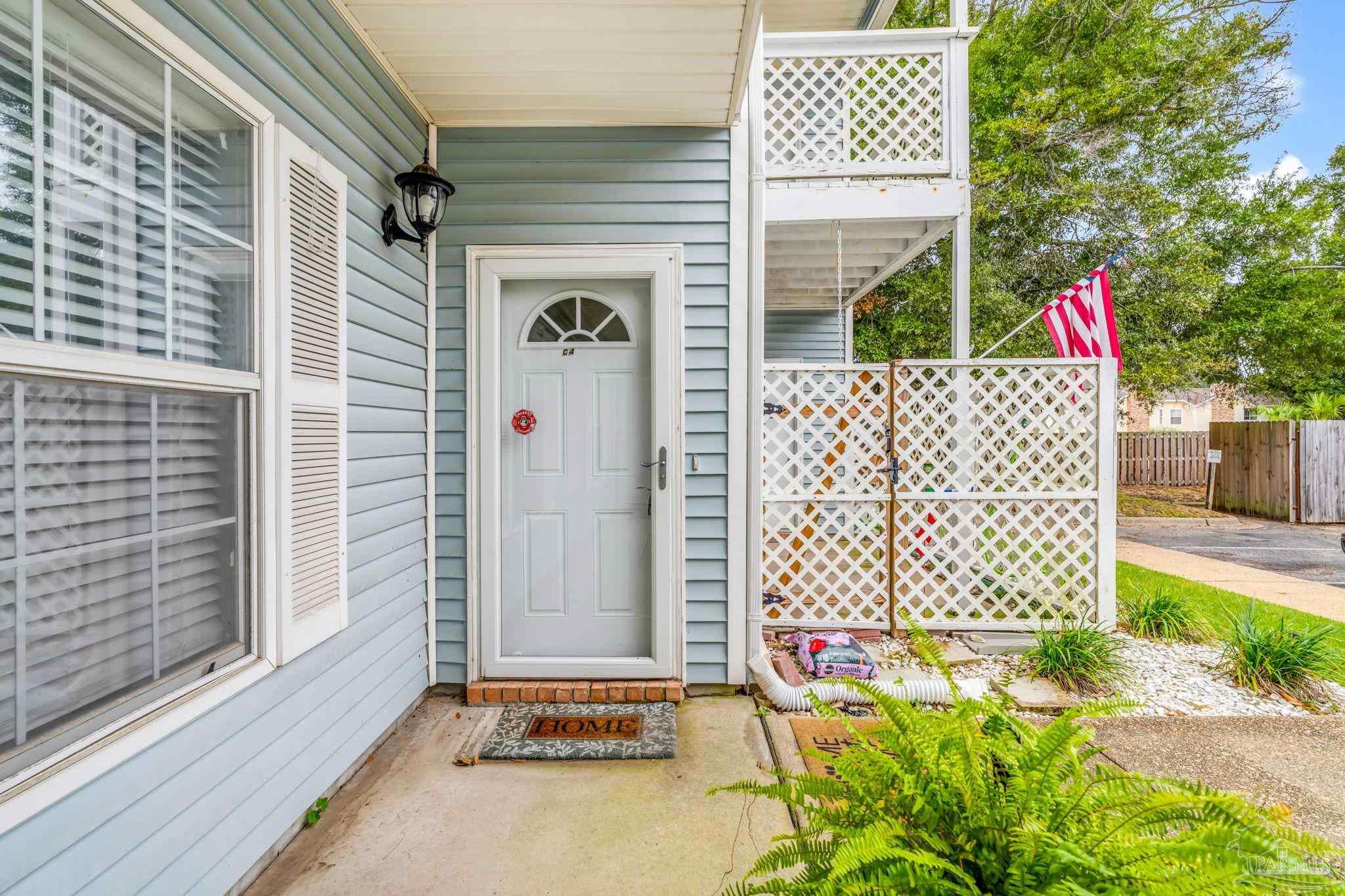 601 East Burgess Road, Unit C4 Pensacola, FL 32504 - Photo 5 of 28 a front view of a house with a garage