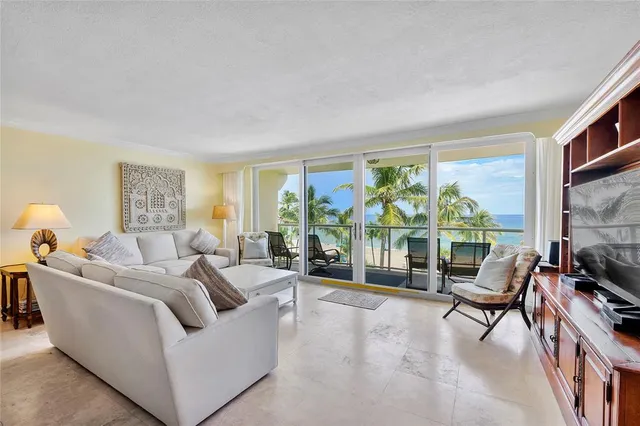 a kitchen with stove and chairs