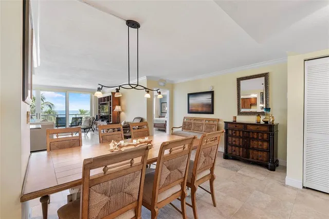 a view of a chairs and table in the balcony