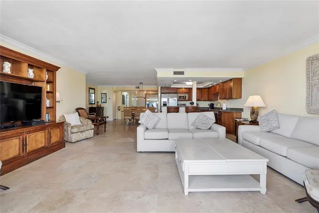 a bedroom with a large bed and a large window