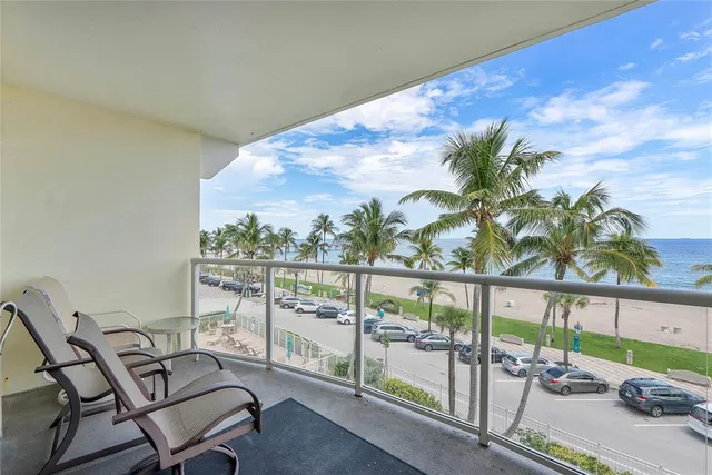 a view of a balcony with chairs