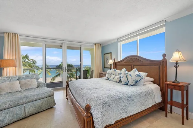 a bedroom with bed and a couch