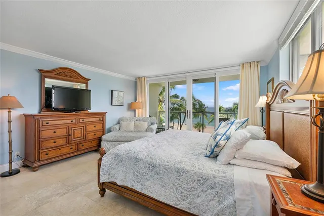 a bedroom with a bed and a tv