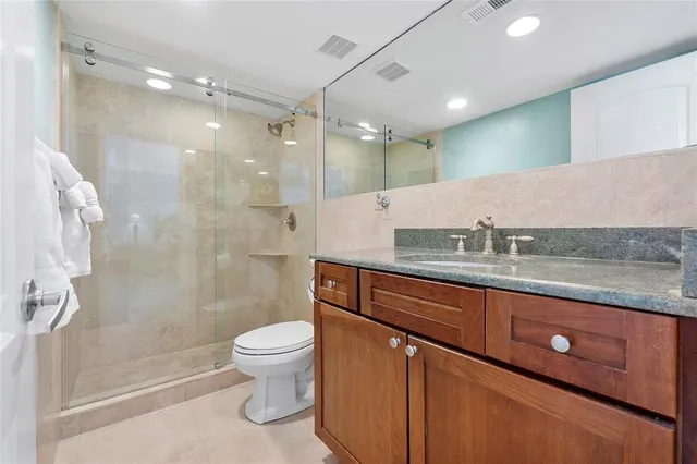 a view of a backyard with a garden and furniture