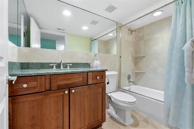 a view of a house with a yard and potted plants