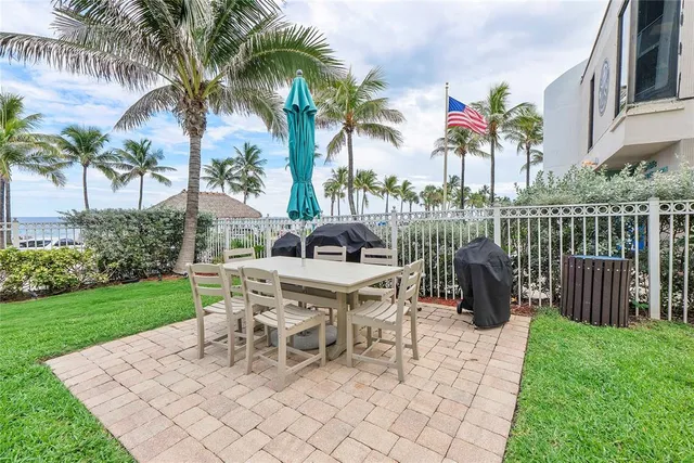 a view of a lake with couches in front of house
