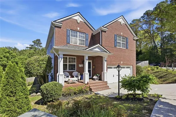 a front view of a house with garden
