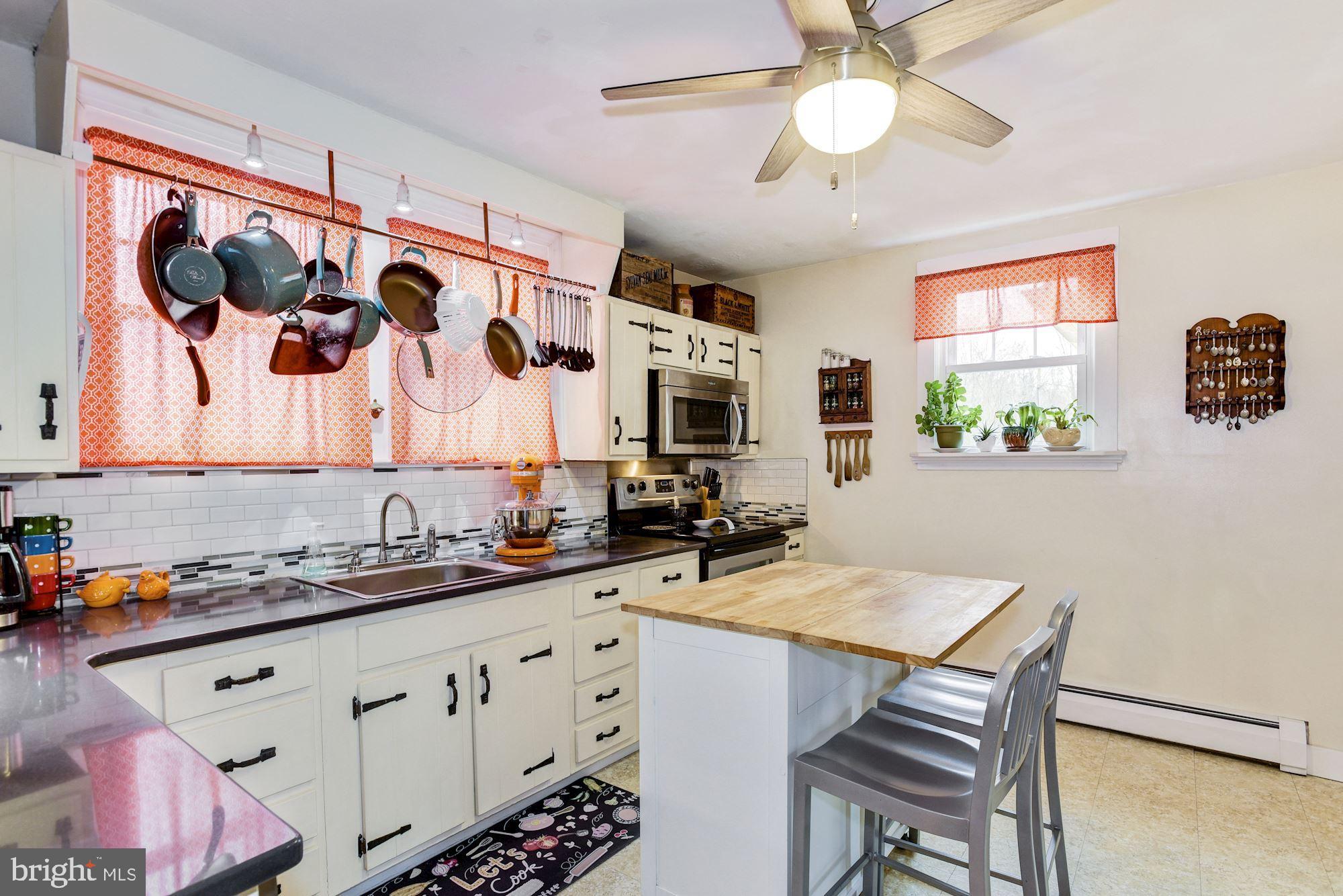 100 Chairville Road Medford, NJ 08055 - Photo 14 of 37 a kitchen with a sink and a stove