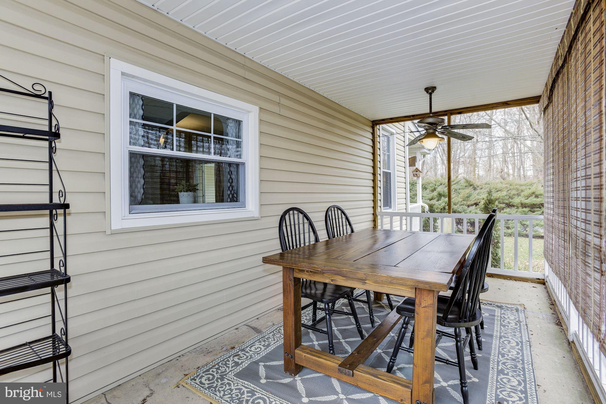100 Chairville Road Medford, NJ 08055 - Photo 22 of 37 a table and chairs in patio of a house