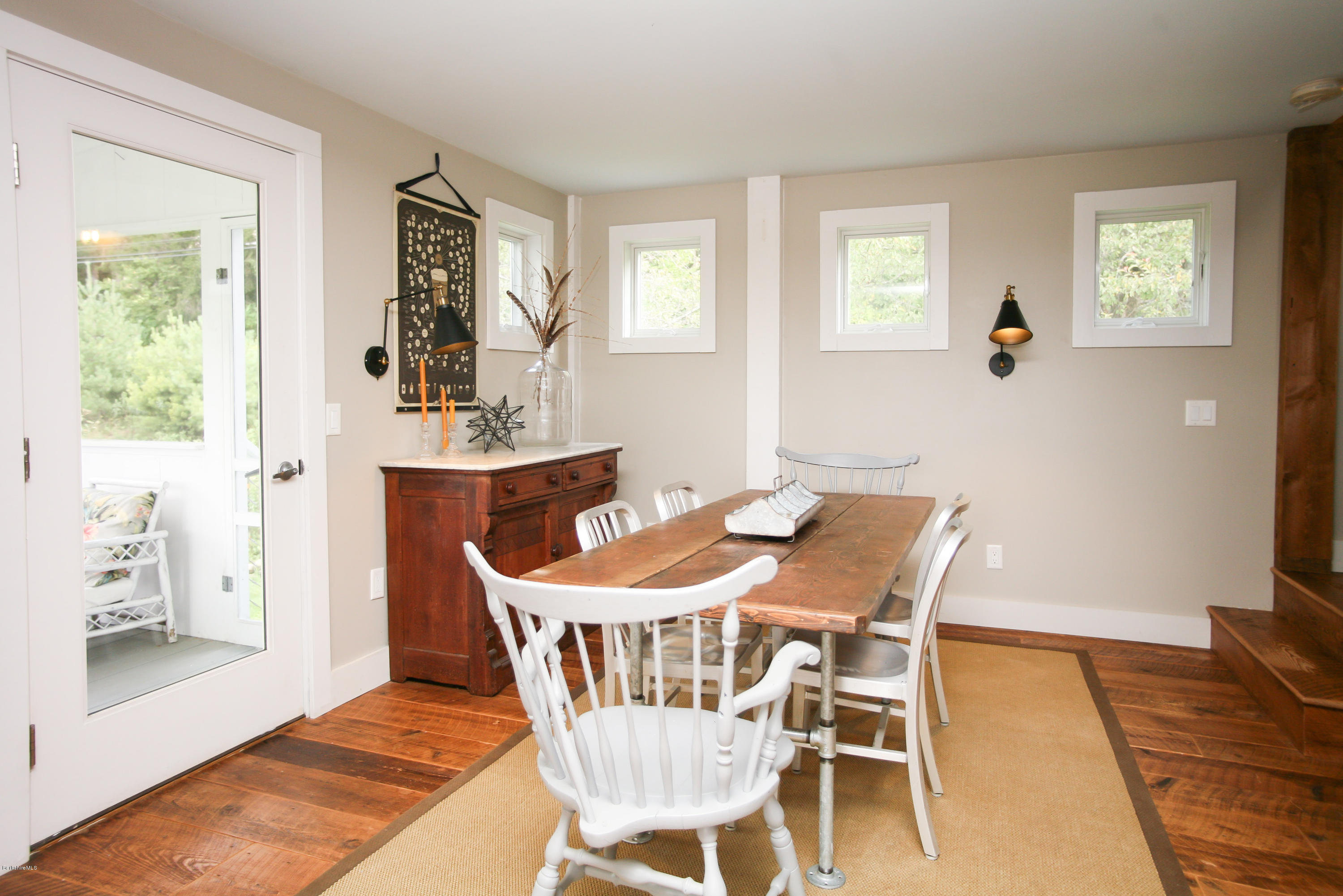 394 Main Road Monterey, MA 01245 - Photo 12 of 33 a view of a dining room with furniture and wooden floor