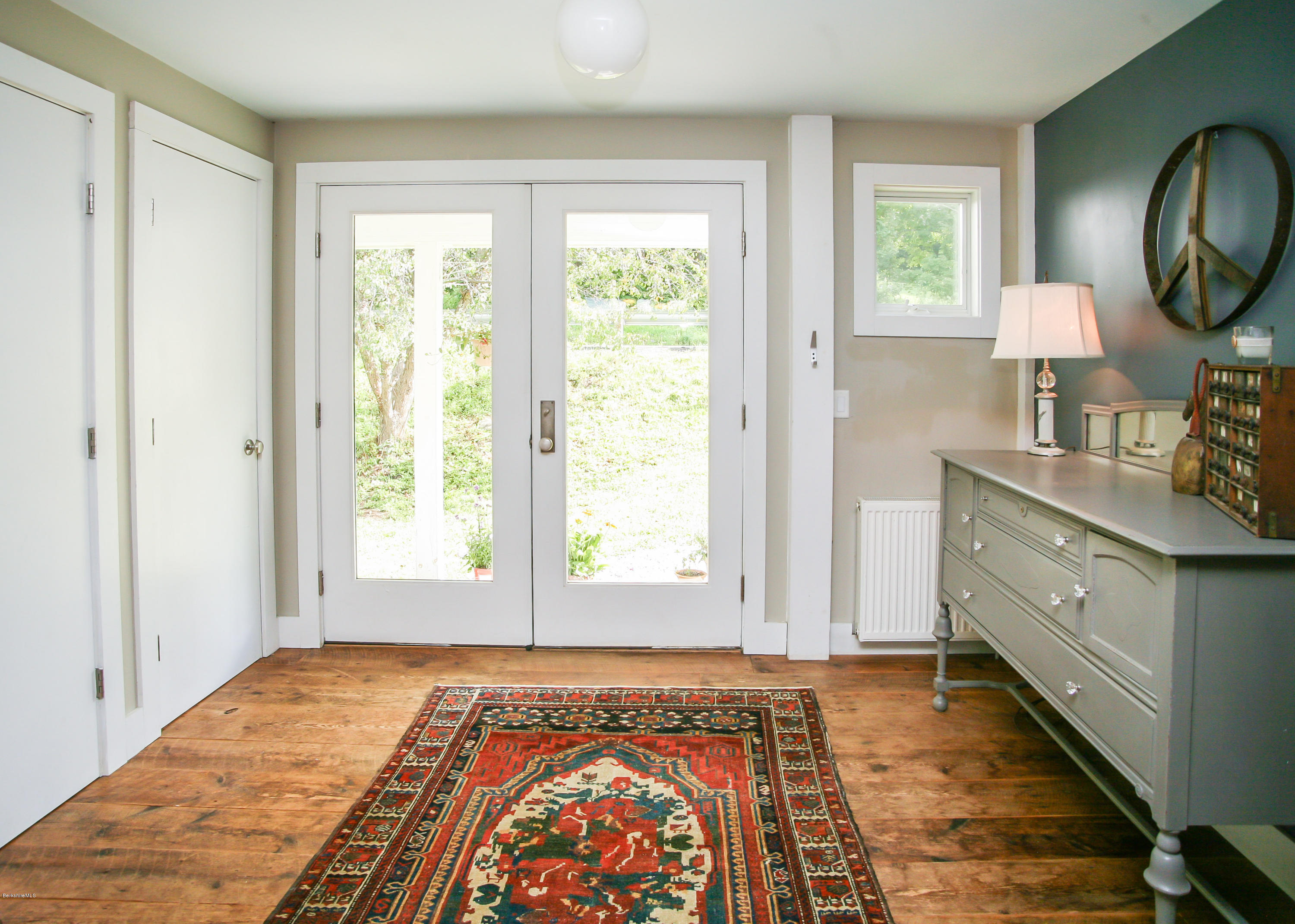 394 Main Road Monterey, MA 01245 - Photo 16 of 33 a view of a bedroom with wooden floor and window