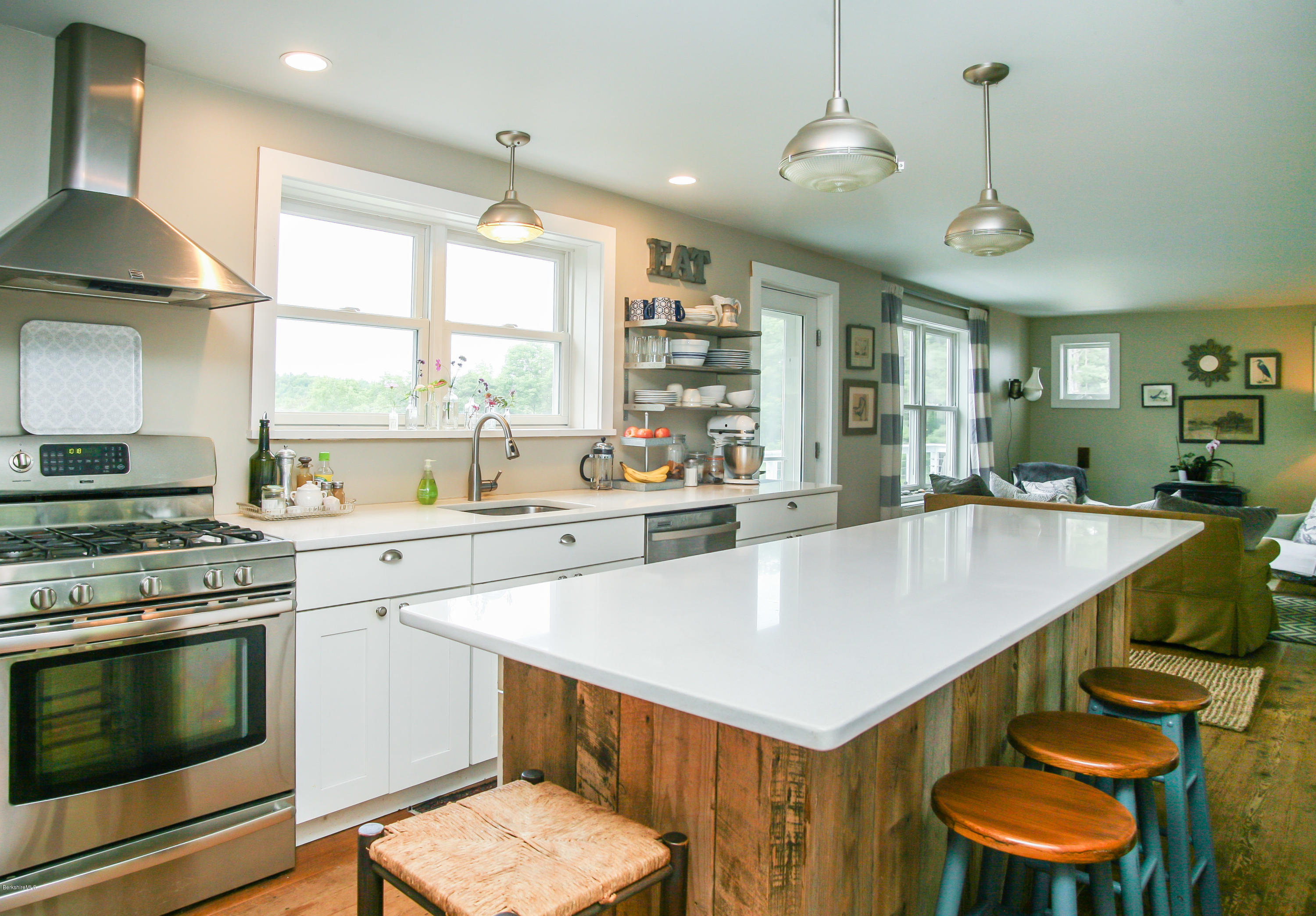 394 Main Road Monterey, MA 01245 - Photo 18 of 33 a kitchen with a stove a sink and a refrigerator