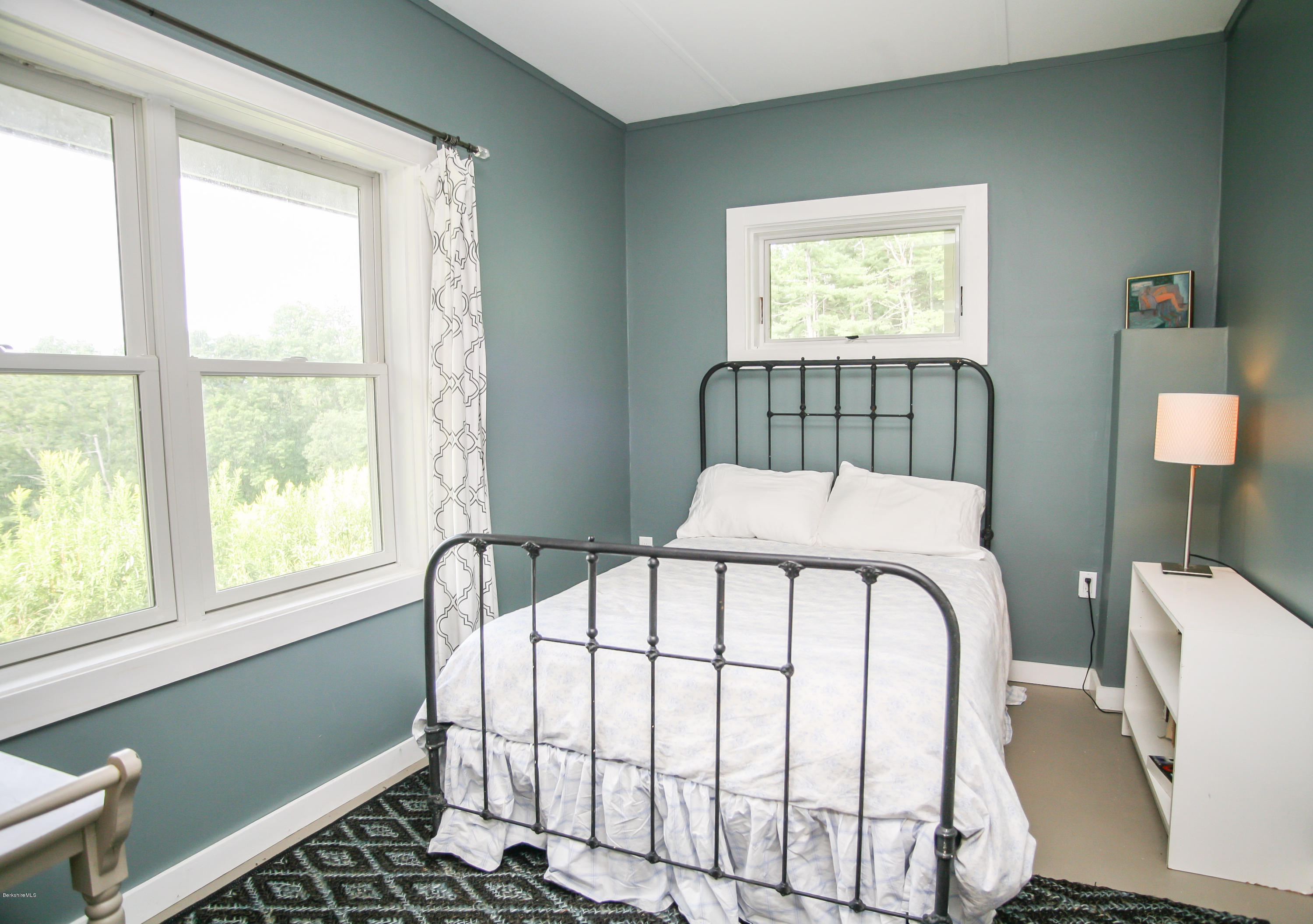 394 Main Road Monterey, MA 01245 - Photo 21 of 33 a white bed sitting in a bedroom next to a window