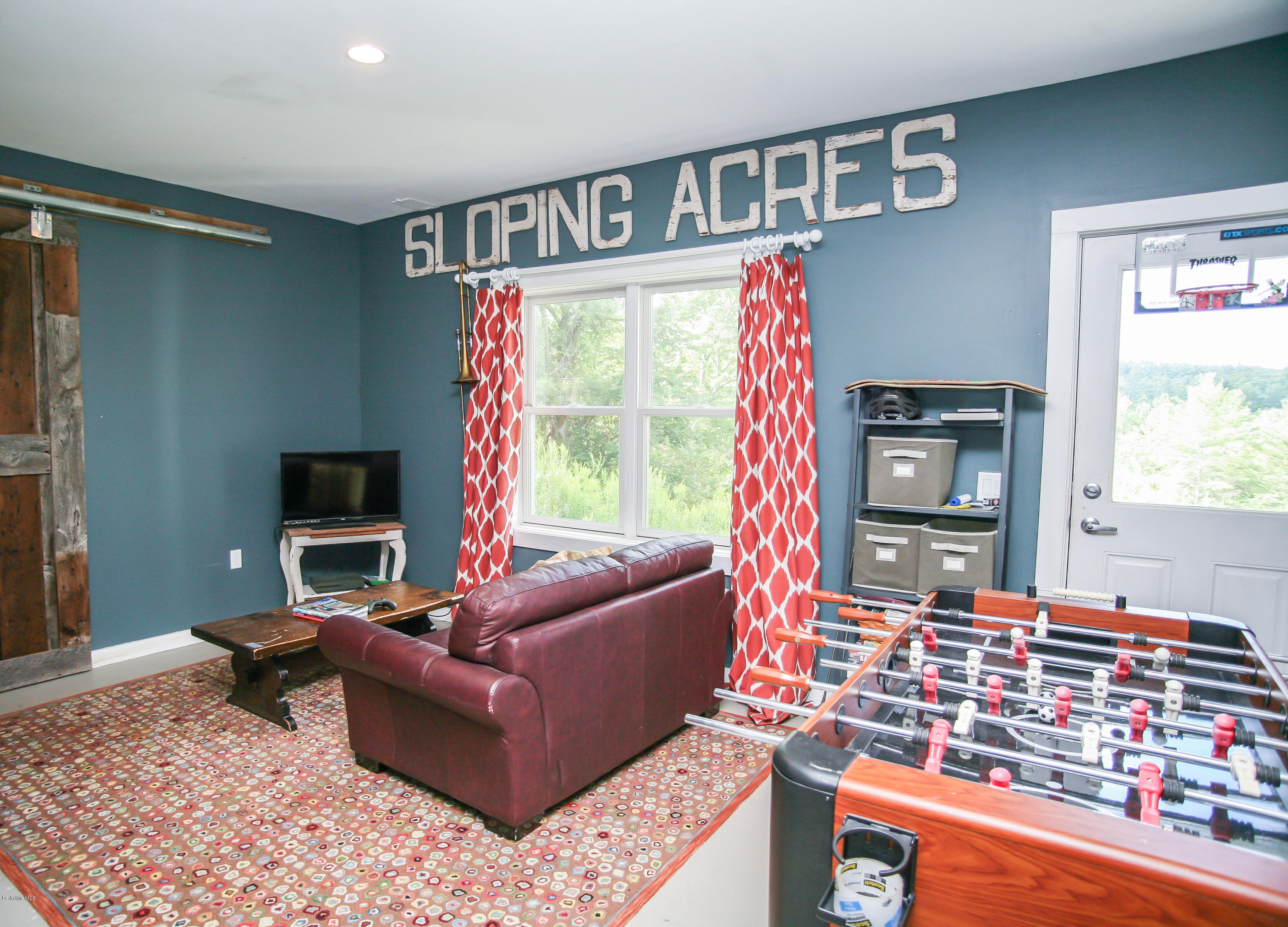 394 Main Road Monterey, MA 01245 - Photo 24 of 33 a living room with furniture and a window