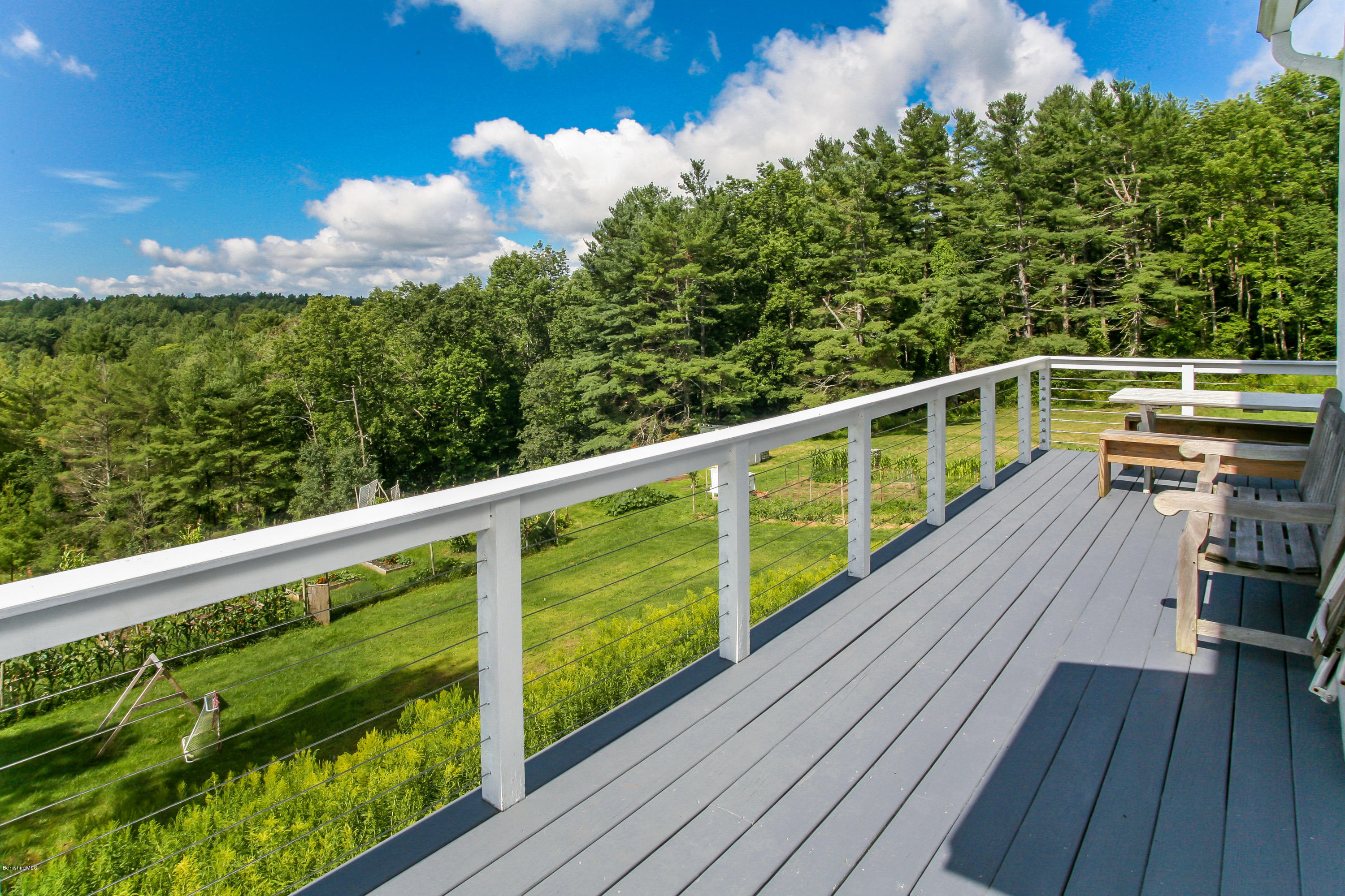 394 Main Road Monterey, MA 01245 - Photo 26 of 33 a view of balcony with wooden floor and fence
