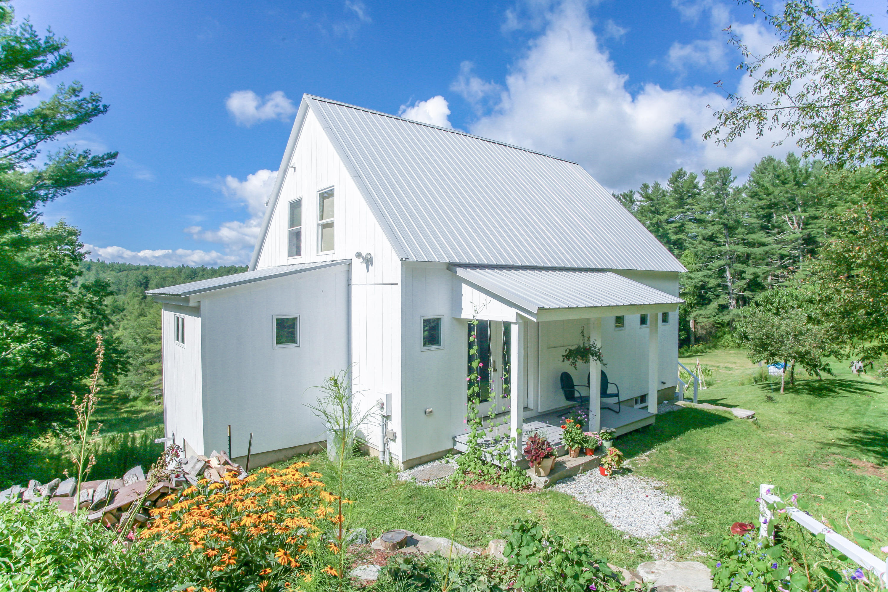 394 Main Road Monterey, MA 01245 - Photo 29 of 33 a view of a house with backyard