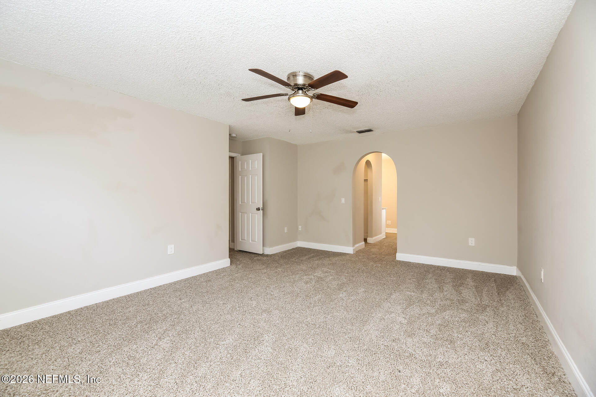 2652 Sunrise Ridge Lane Jacksonville, FL 32277 - Photo 11 of 22 an view of a room with ceiling fan and window