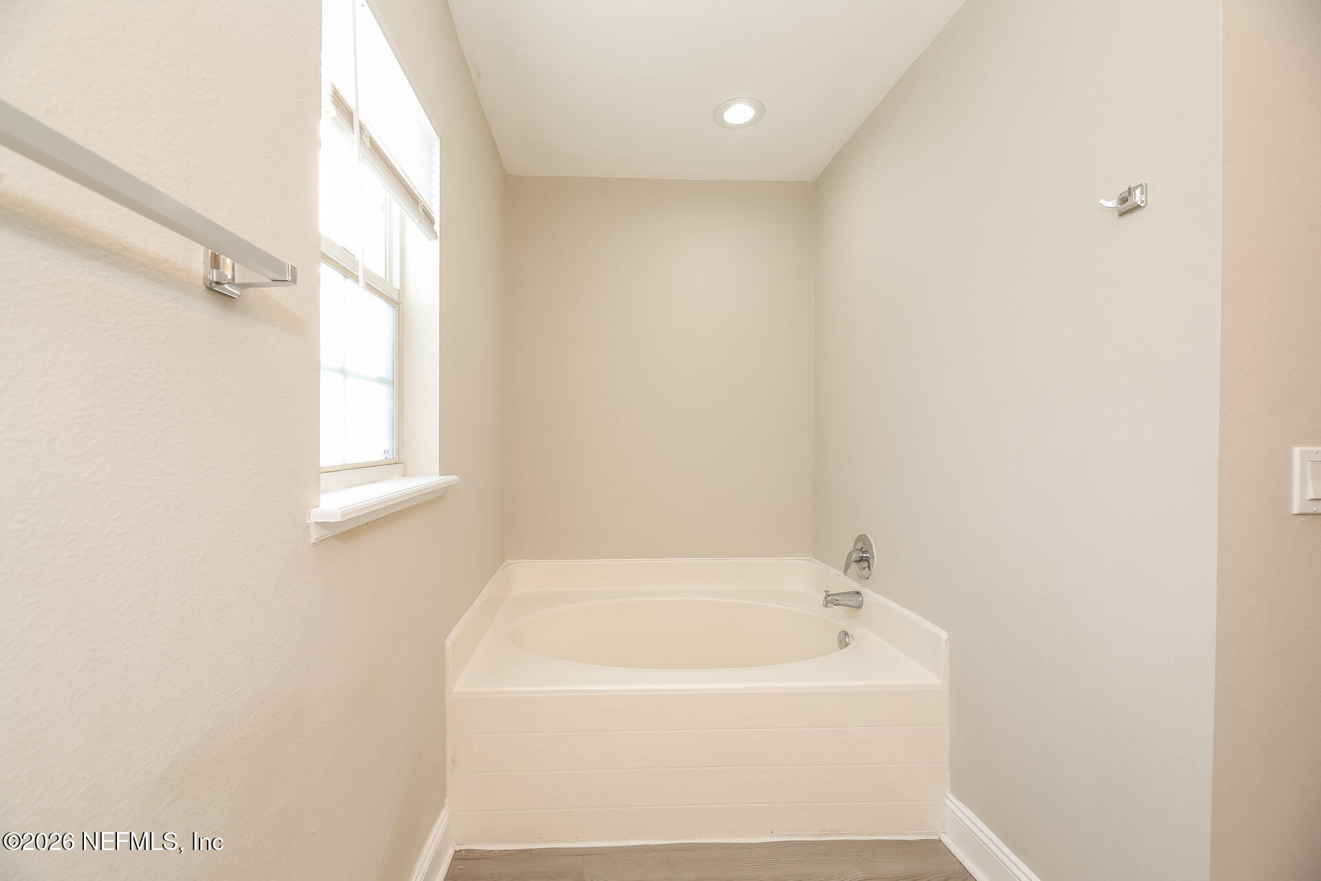 2652 Sunrise Ridge Lane Jacksonville, FL 32277 - Photo 13 of 22 a white bath tub sitting in a bathroom
