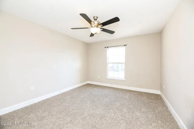 an a ceiling fan and a window