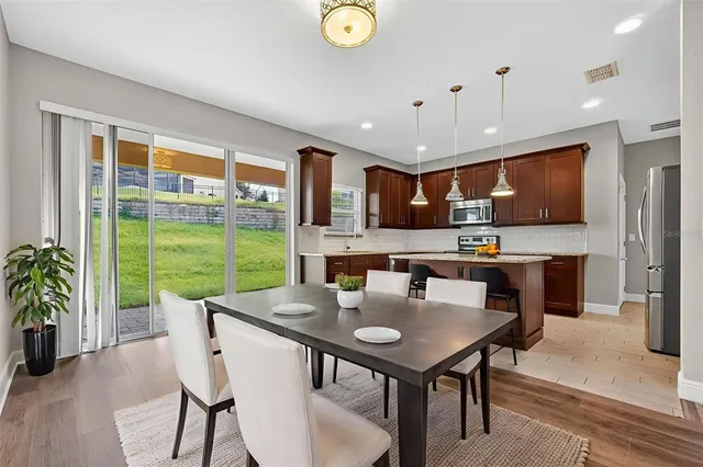 a kitchen with stainless steel appliances granite countertop counter space a sink and cabinets