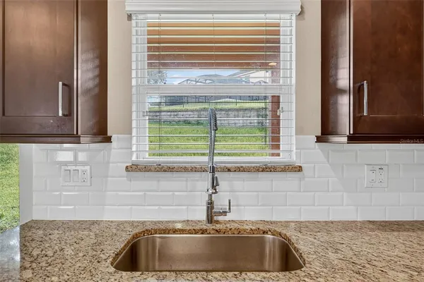 a bedroom with a bed flat screen tv and a couch