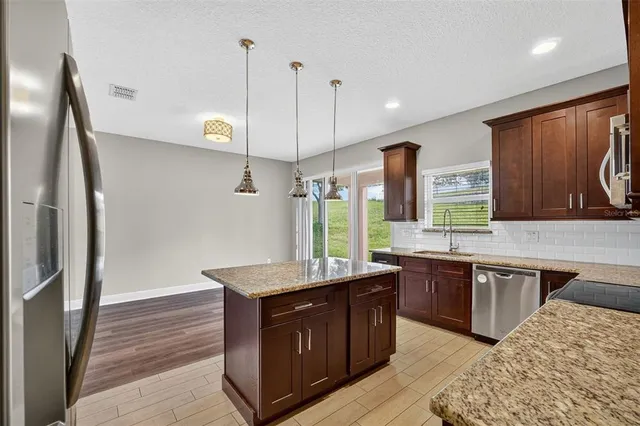 a white toilet sitting next to a white wall