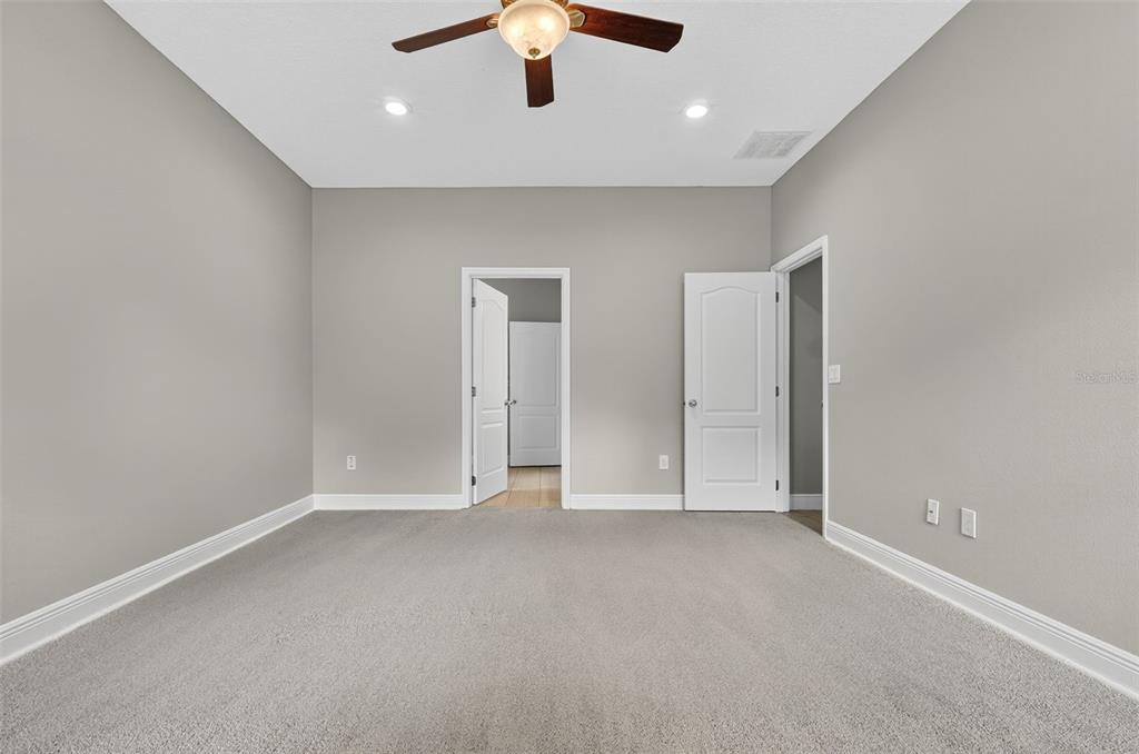 280 Wallrock Drive Ocoee, FL 34761 - Photo 31 of 88 an empty room with ceiling fan and window