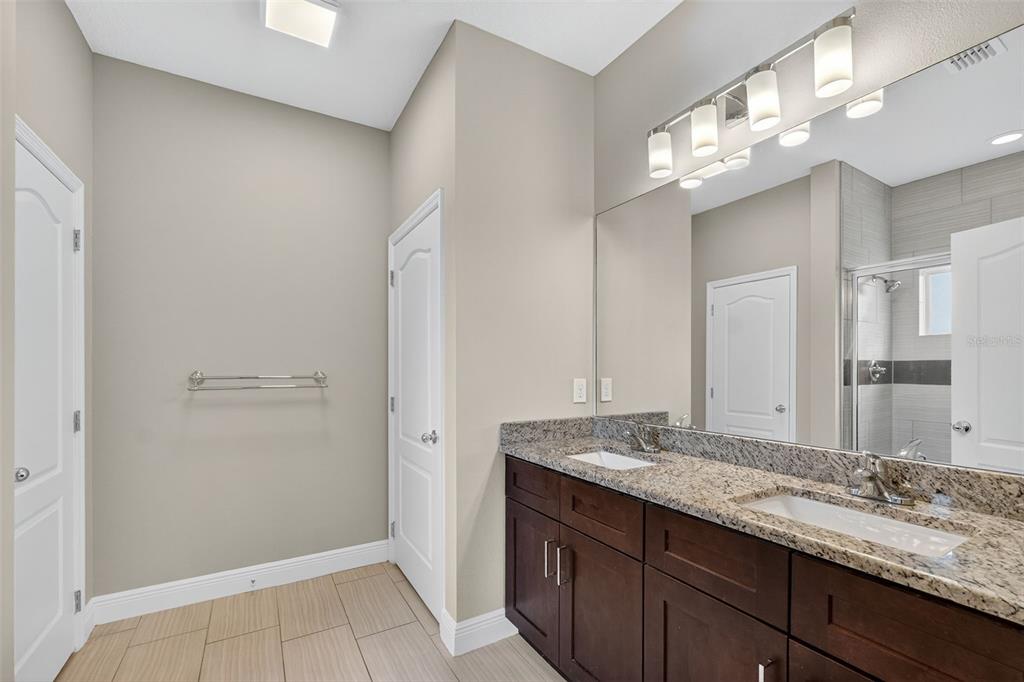 280 Wallrock Drive Ocoee, FL 34761 - Photo 33 of 88 a bathroom with a granite countertop sink and a mirror