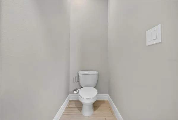 a view of an empty room with a ceiling fan