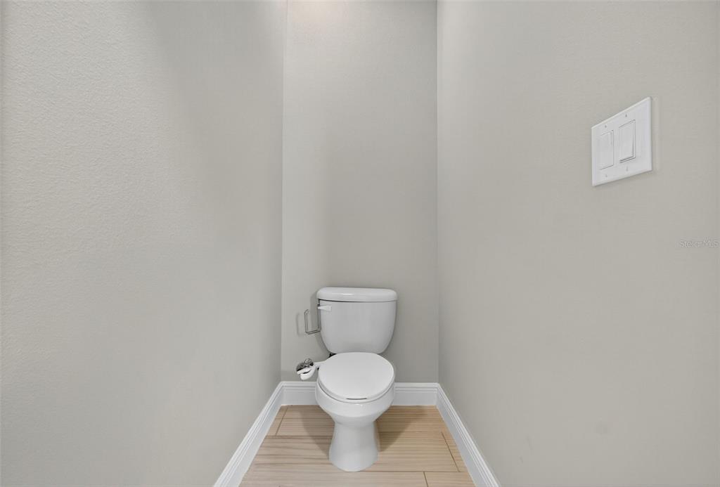 280 Wallrock Drive Ocoee, FL 34761 - Photo 35 of 88 a white toilet sitting next to a white wall