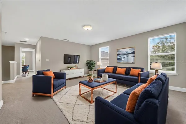 a bedroom with a bed and a television