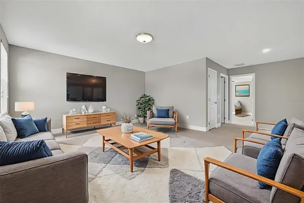 an aerial view of residential houses with outdoor space and swimming pool