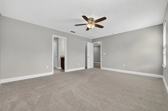 a front view of a house with a yard and a garage