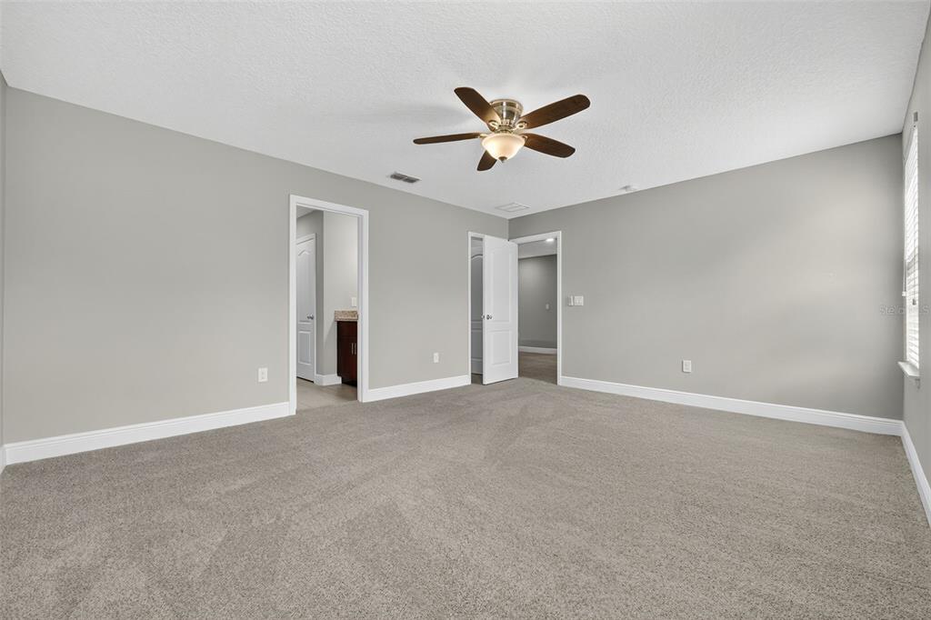 280 Wallrock Drive Ocoee, FL 34761 - Photo 47 of 88 a view of an empty room with a ceiling fan