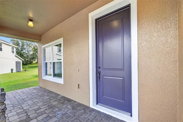 a view of an entryway with wooden floor