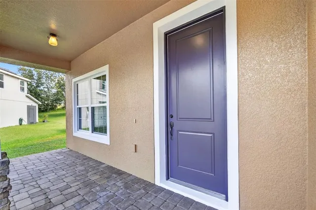 a view of an entryway with wooden floor