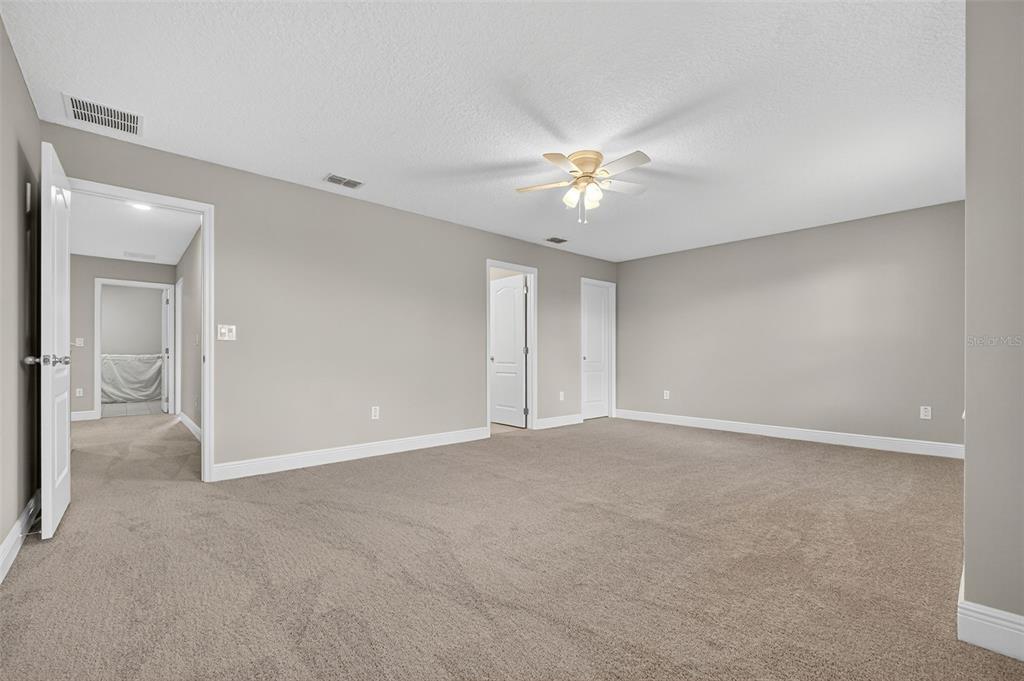 280 Wallrock Drive Ocoee, FL 34761 - Photo 53 of 88 a view of an empty room with a ceiling fan