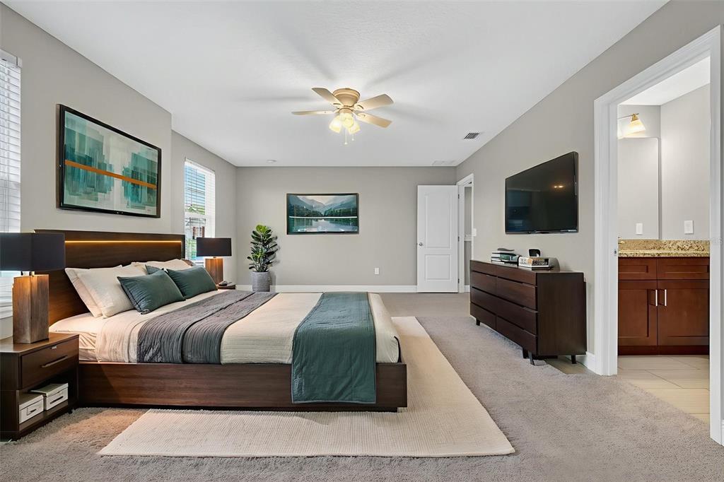 280 Wallrock Drive Ocoee, FL 34761 - Photo 55 of 88 a bedroom with a large bed and a flat screen tv