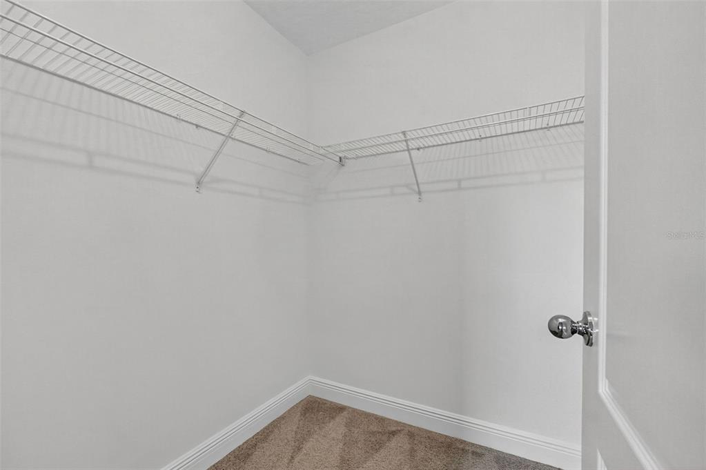 280 Wallrock Drive Ocoee, FL 34761 - Photo 56 of 88 a view of a room with racks on the wall